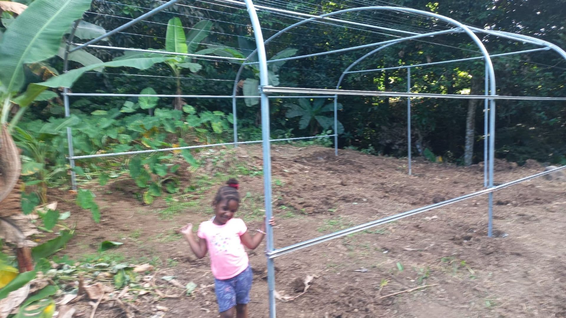 Greenhouse frame going up on the farm
